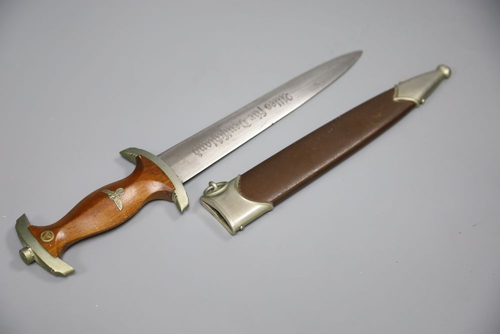 A German WW2 Third Reich SA dagger, by C. G. Haenel, Suhl, the 22cm blade, inscribed Alles Fur Deutschland with brown nickel mounted